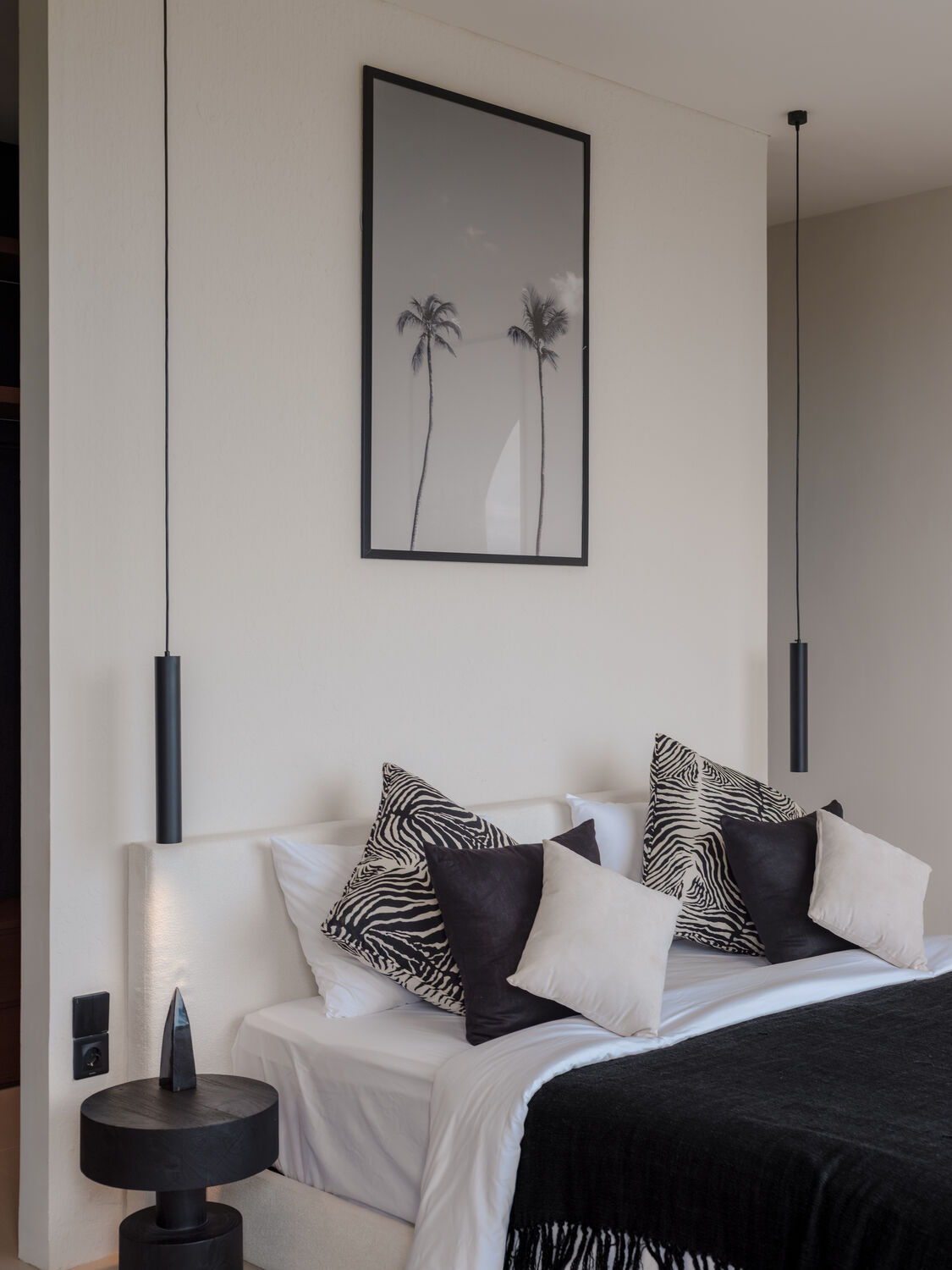 Bright bedroom with framed artwork