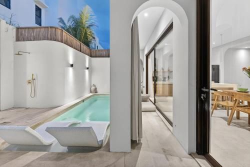 Private pool and sun loungers at Casa Padang Padang